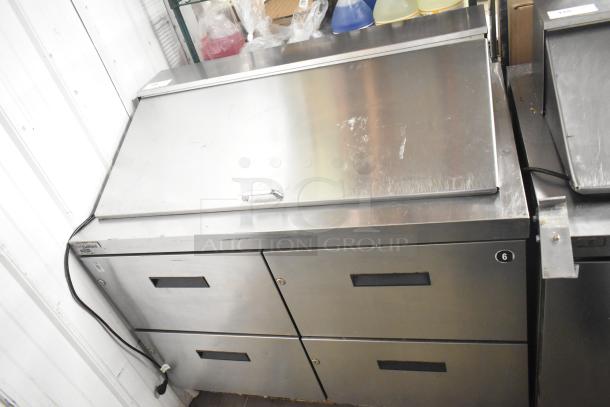 Delfield D4448N-18M-A22 prep table, 4 drawers, stainless steel, 115V, 1 phase, minor surface wear, ideal for commercial use.
