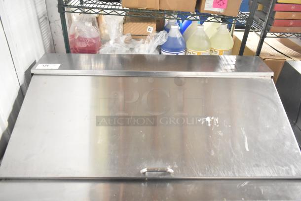 Delfield D4448N-18M-A22 commercial sandwich salad prep table in stainless steel with mega top and 4 drawers, used condition.