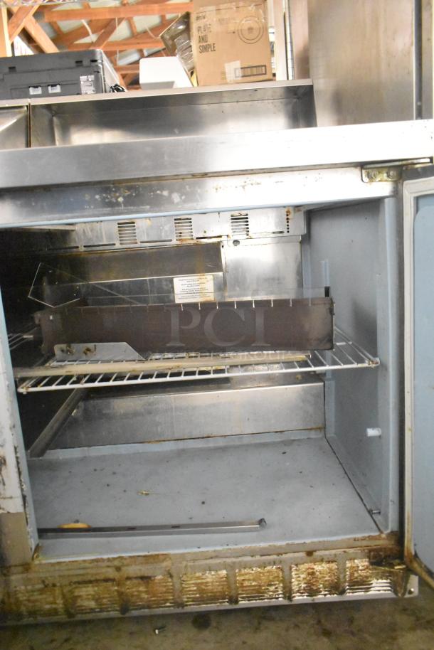 2017 Delfield 4460N-24M commercial sandwich salad prep table missing lid. Stainless steel, used condition, 115V, 1 phase.