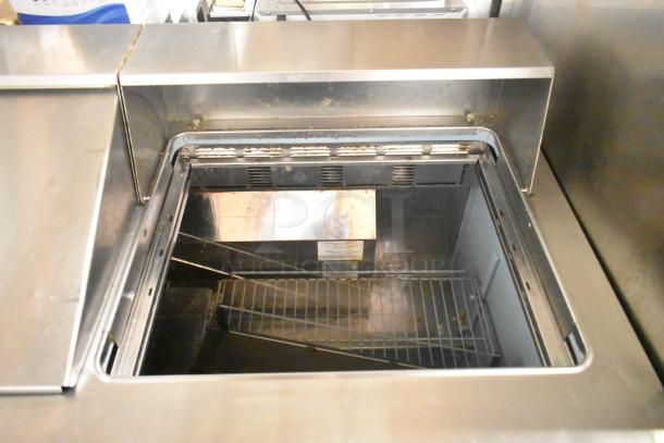 2017 Delfield 4460N-24M commercial sandwich prep table in stainless steel, missing lid, 115V, 1 phase.