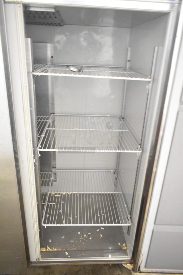 2019 Delfield GBF2P-S commercial 2-door reach-in freezer, 115V/1 Phase, showing interior shelves, some wear visible.