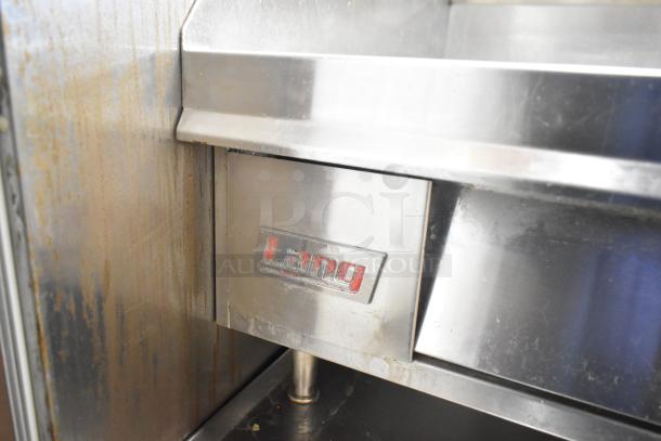 Lang 48T commercial electric flat top griddle with thermostatic controls, stainless steel, 208/240 volts, needs cleaning.