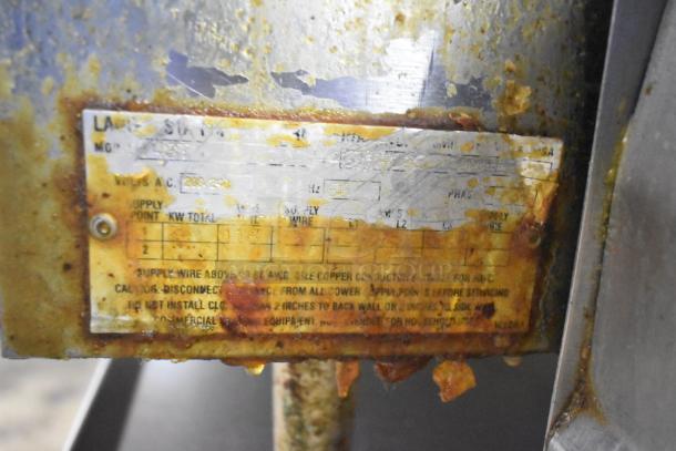 Lang 48T Commercial Electric Griddle, 208/240V, with worn label, visible wear, and some rust; thermostatic controls.