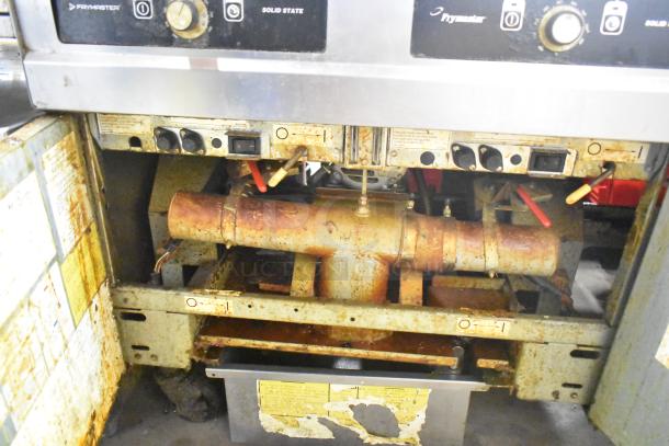 Frymaster 2 Bay Deep Fat Fryer, includes filtration system and dumping station, on commercial casters. Used condition.