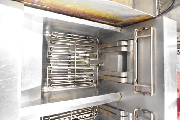 Frymaster 2-bay commercial fryer with dumping station and filtration system on casters, showing interior condition and components.