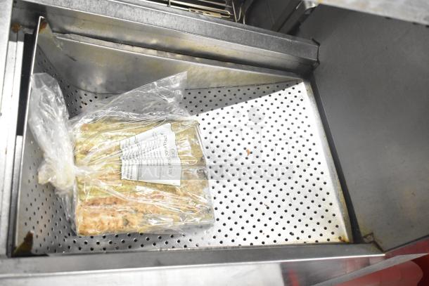 Frymaster 2 Bay Deep Fat Fryer with dumping station, filtration system, on casters; includes bagged contents in fryer.