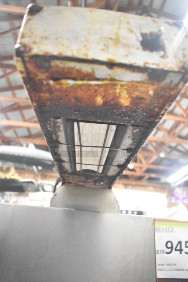 Frymaster commercial 2-bay deep fat fryer with dumping station, filtration system, visible wear, on commercial casters.