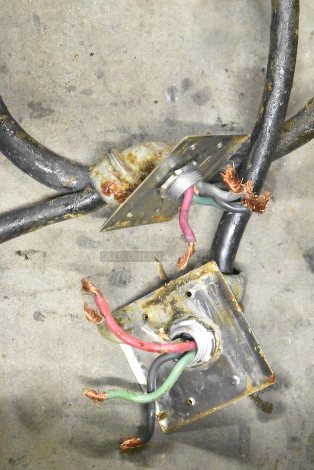 Frymaster fryer power cables and connectors, detached, show minor rust and wear, indicating need for maintenance.