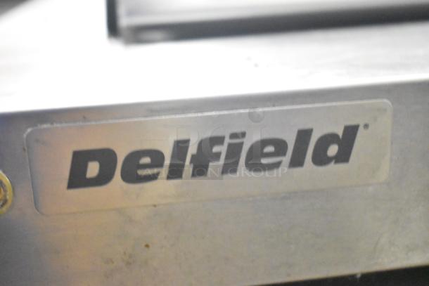 Delfield logo on 2024 Delfield 4460NP-24M Commercial Sandwich Salad Prep Table, Bain Marie Mega Top.