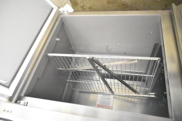 2024 Delfield 4460NP-24M sandwich prep table with wire rack inside. 115V, 1 phase, mega top design.