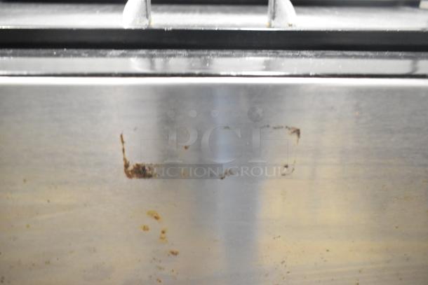 Perlick BC24 Commercial Back Bar Bottle Cooler with Speedwell. Stainless steel surface shows minor wear. 115V, 1 Phase.