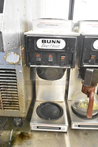 Bunn SP commercial countertop 3 burner coffee machine with visible wear. Features Pour-O-Matic branding and caution labels.