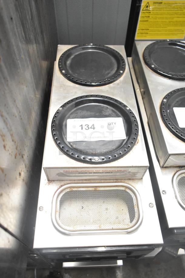 Bunn SP Commercial Coffee Machine with 3 burners, countertop model. 120 volts, 1 phase. Visible wear. Auction tag reads "134 QTY".