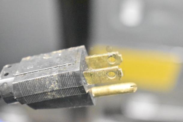 Bunn SP Commercial Coffee Machine plug, showing a used three-prong connector, part of a 120 Volts, 1 Phase setup.