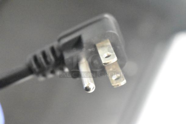 Close-up of a three-pronged plug from a 2025 Vissani MDTF18WHR5 cooler with freezer. 115 volts, 1 phase power.