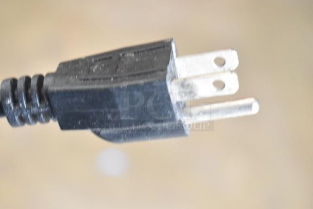 Close-up image of a plug for an Avantco 193BCTD48W bakery display case, showing standard 3-prong design.