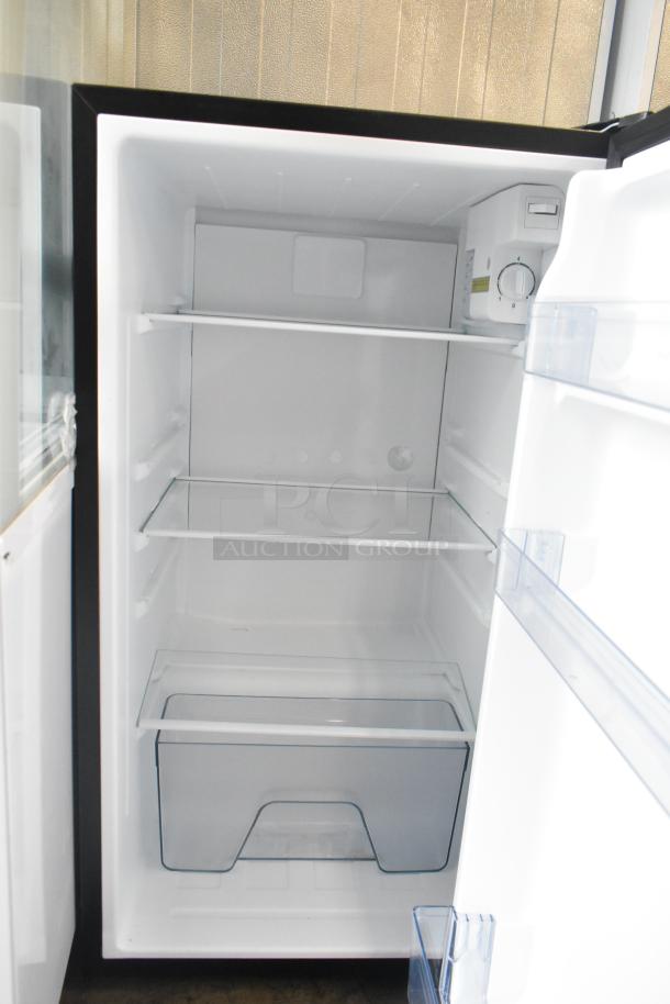 Brand new Vissani HVAR32SE mini cooler, 115V, 1 Phase. Features scratch and dent exterior, glass shelves, pristine interior.