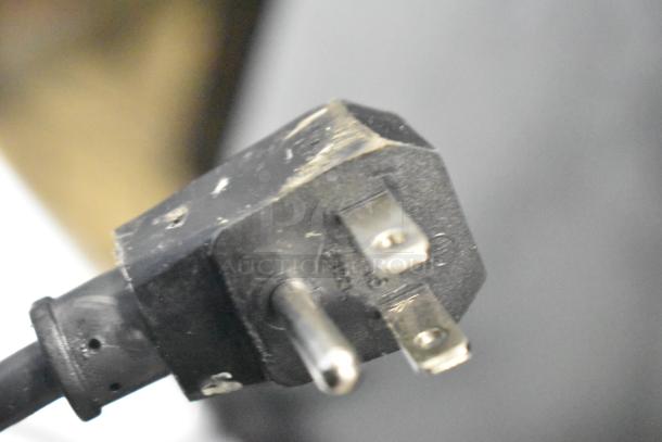 Close-up of a three-prong plug from the Vissani MDTF10BKES4 Reach In Cooler w/ Freezer, 115 Volts, 1 Phase.