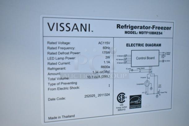 Alt text: Vissani MDTF10BKES4 reach-in cooler freezer label showing voltage, frequency, defrost power, and capacity details.