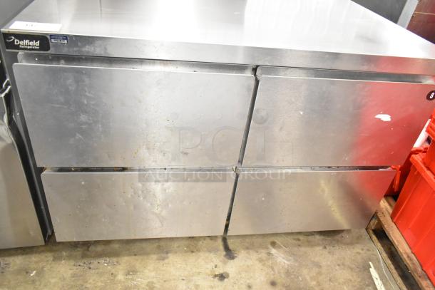 2017 Delfield GUR48P-D commercial 4-drawer cooler, stainless steel, 115 volts, 1 phase. Shows wear, Delfield label visible.
