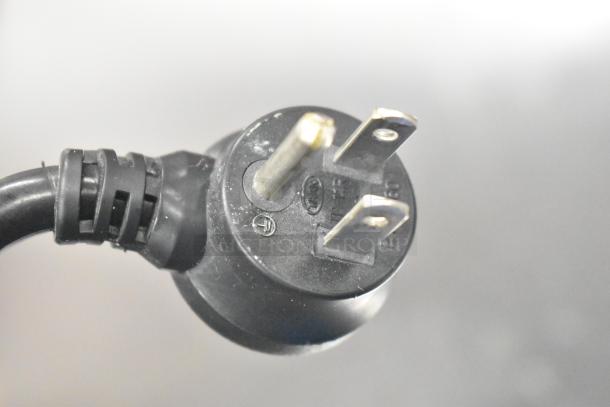 Close-up of a power plug for the 2017 Delfield GUR48P-D commercial cooler, 115 volts, 1 phase.