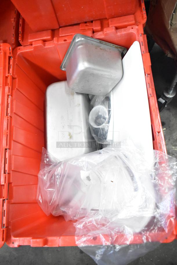 13 red poly bins filled with napkins, drop ins, cups, and utensils. Bins show light wear, multipurpose storage use.