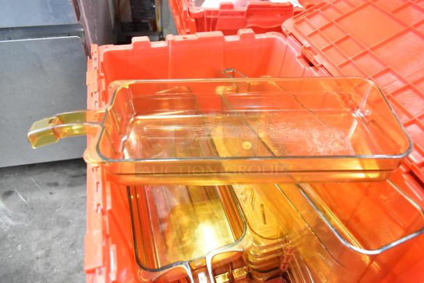 Red poly bin with amber plastic drop-ins, includes napkins, cups, and utensils. Auction set of 13 bins, used condition.