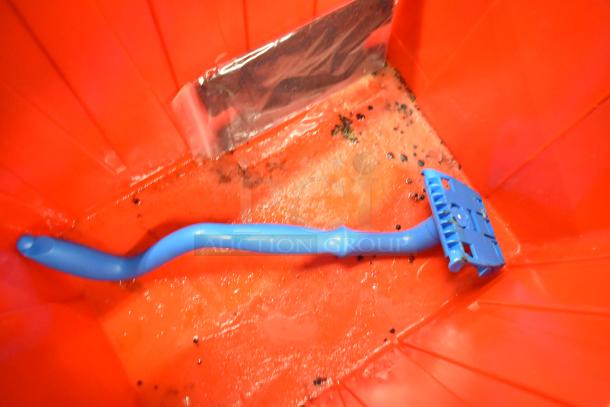 Red poly bin with blue handle inside, part of a set of 13 bins containing napkins, cups, utensils. Auction lot detail.