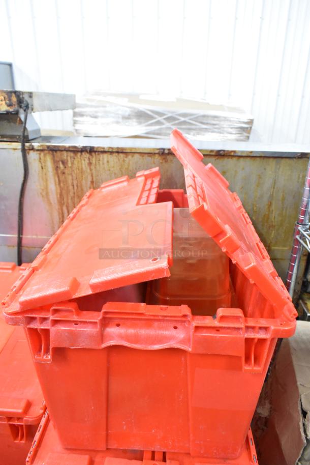 13 red poly bins containing napkins, holding bin drop-ins, cups, and utensils. Auction item, 13 times your bid.