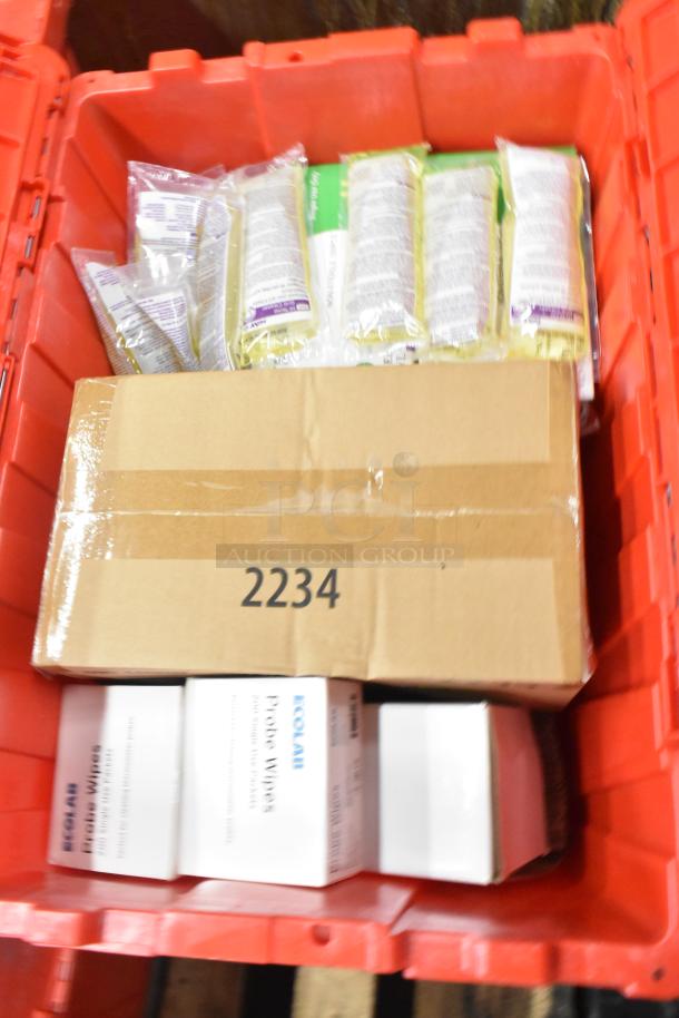 Red poly bin containing napkins, dedicated holding bin drop-ins, cups, utensils, and boxes labeled “Ecolab Probe Wipes” and “2234”.