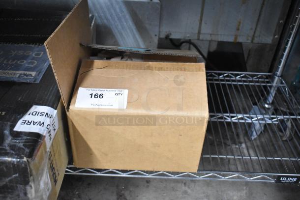 Cardboard box of receipt paper rolls on metal shelf, labeled with auction tag 166 from PCI Auctions.