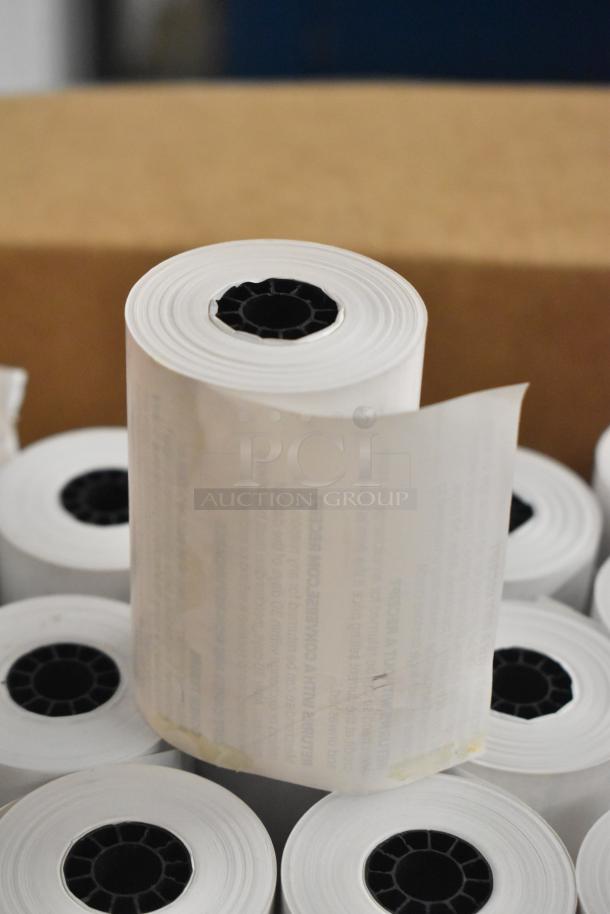 Box of receipt paper rolls, new condition, multiple white rolls with black core, suitable for cash registers.