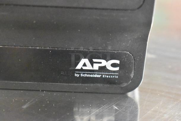 APC by Schneider Electric label on a black uninterruptible power supply, indicating brand authenticity.