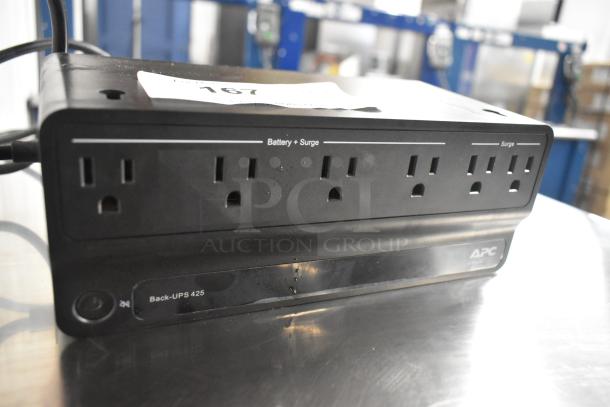 APC Back-UPS 425 Uninterruptible Power Supply, offers battery and surge protection, in good condition, visible label.