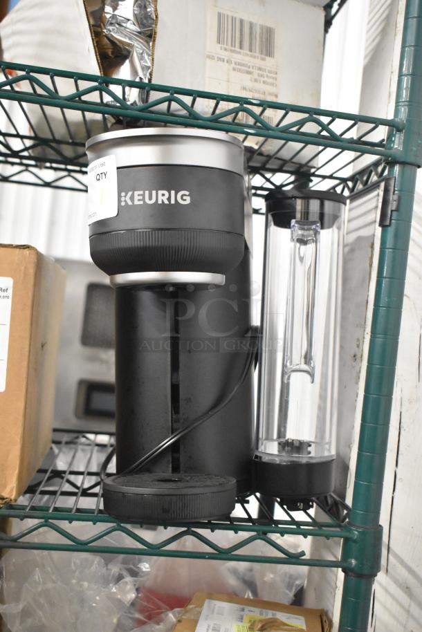 Keurig K91 Single Serve Coffee Maker, 120V, 1 Phase, black, with attached water reservoir, in good condition.