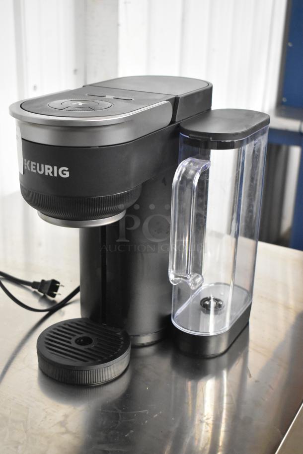 Keurig K91 Single Serve Coffee Maker, black, 120V, 1 Phase, with clear water reservoir. Appears in good condition.