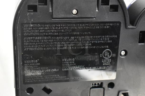 Keurig K91 Single Serve Coffee Maker, labels indicating 120V, 1 Phase. Warning for risk of fire and hot surfaces. Model K91.