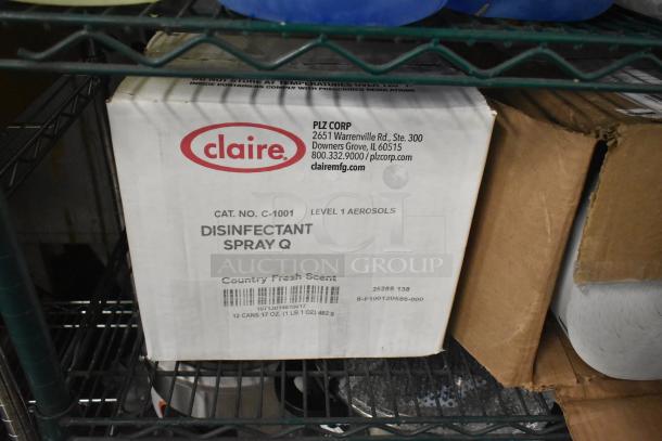 Box of Claire Disinfectant Spray Q on metal shelf. Cat. No. C-1001, Country Fresh Scent, contains 12 cans of 17 oz aerosol.