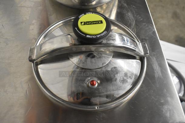 Monix Classica Pressure Steamer Pot, stainless steel, with secure locking lid, red pressure indicator, slight surface wear.