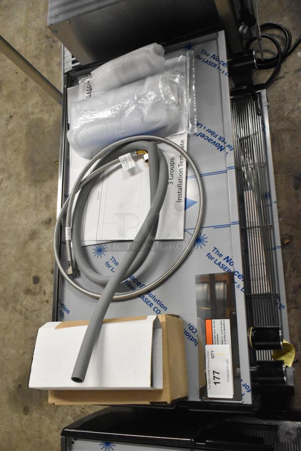 Brand new Gaggia MGV293NPU Vetro Black 3 Group Automatic Espresso Machine, 220/230V, with visible installation components.