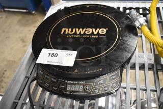 Brand new, scratch and dent Nuwave 30211 induction range, 120V. Black, digital controls, countertop single burner.