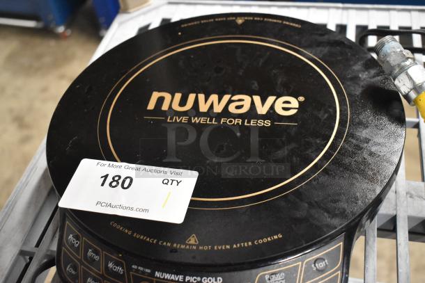 Brand new Nuwave 30211 induction range, single burner, 120 volts, minor scratches, "Live Well For Less" label visible.