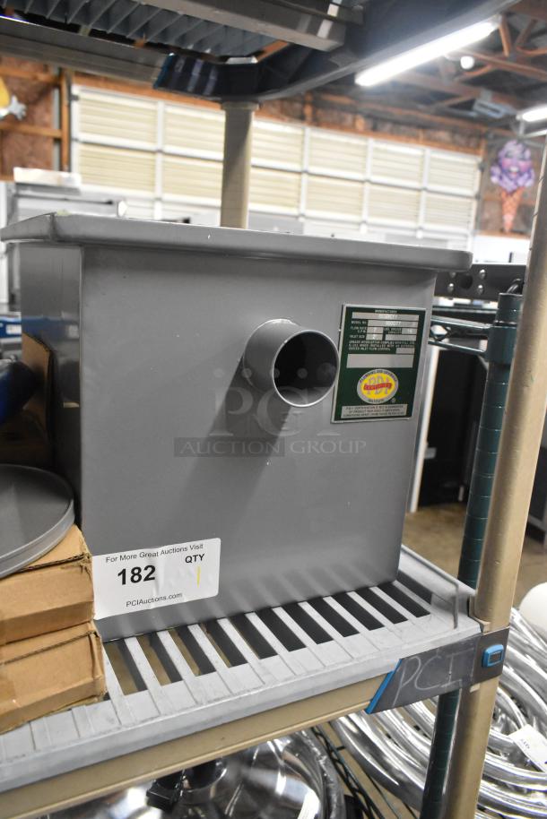 Brand new Regency 600GT7 grease trap, 14 lb. capacity, 7 GPM, 2" non-threaded connections, PDI certified, slight scratches.