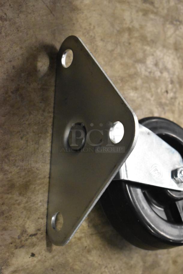 Lot of 4 brand new casters, scratch and dent condition. Features metal mounting plate, black wheel, durable construction.