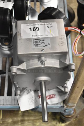 Brand new Nidec motor, 208-240V, 1 phase, slight scratches, label and auction tag visible, unused condition.