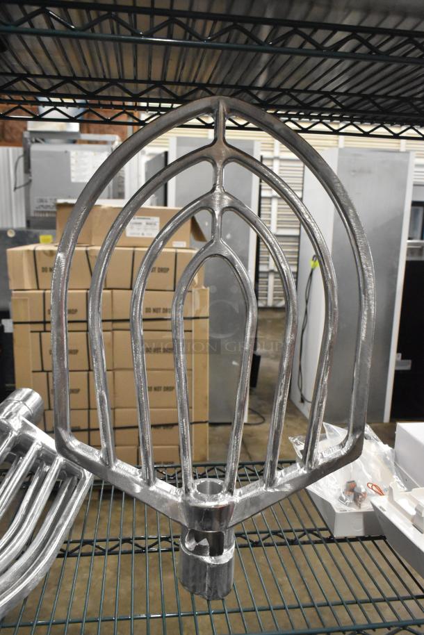 Aluminum flat beater for 60 qt. mixer bowls, brand new with slight scratches, shown on metal shelf.