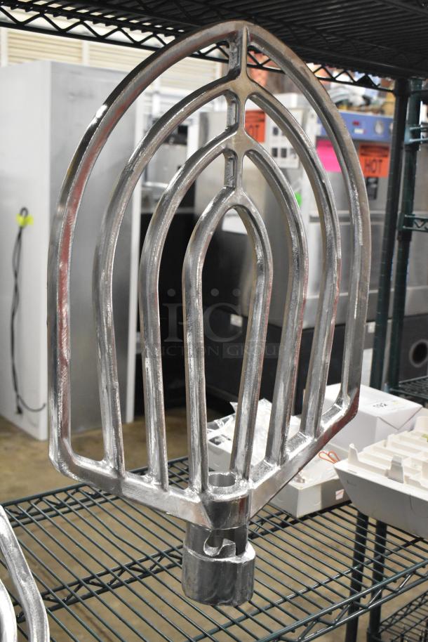 Brand new aluminum flat beater for 60 qt mixer bowls, minor scratches. Essential for large batch mixing. Auction includes three items.