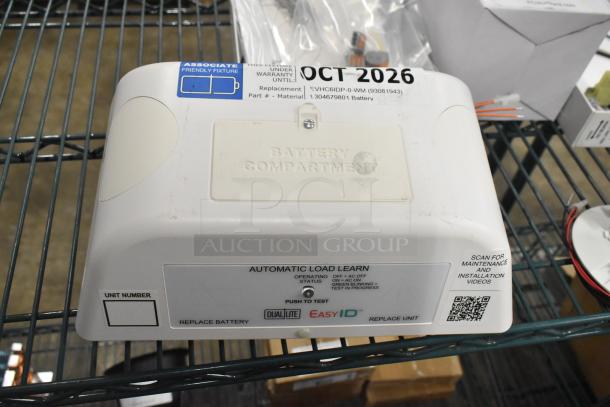 BRAND NEW Dual-Lite EVHC6IDP LED Emergency Wall Light with Hubbell EVSCEZP Enclosure, battery compartment visible.