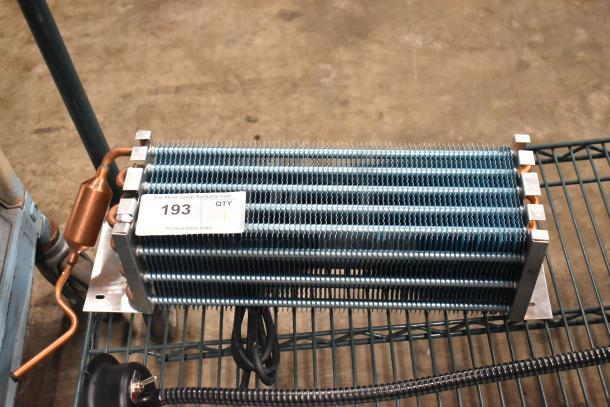BRAND NEW 6R5K370LAA Evaporator Coil, scratch and dent condition, visible copper tubing and metal fins, tag marked 193.