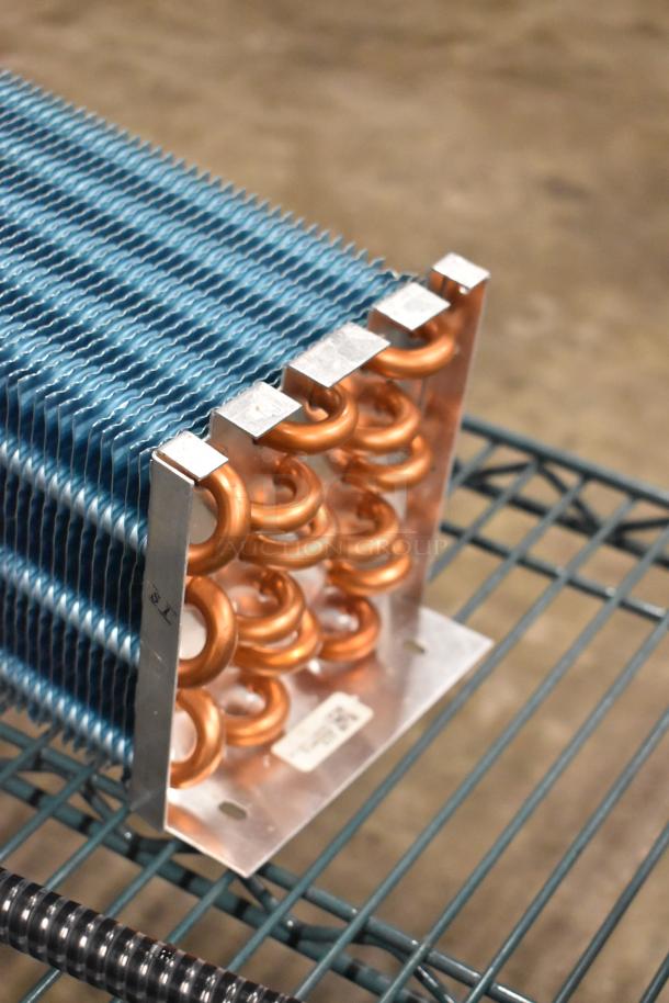 BRAND NEW 6R5K370LAA Evaporator Coil; slight scratches; visible copper tubing and fins; item tag shown.